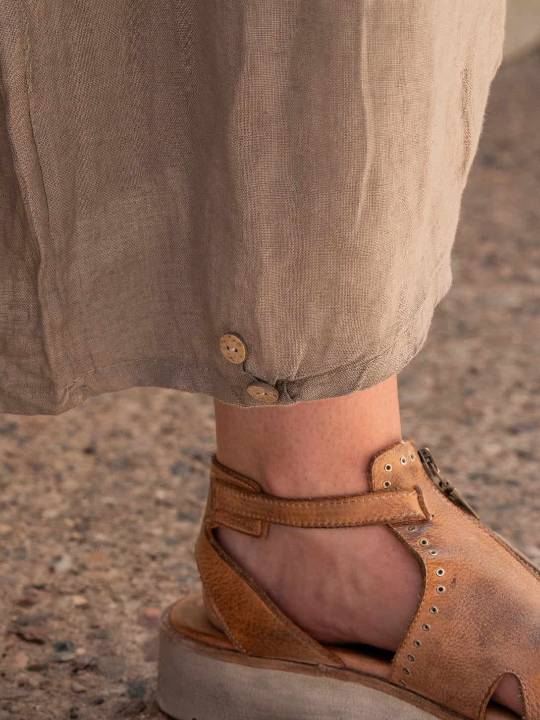 Conscious Coterie Yoli Linen Pant in Taupe on model leg opening detail view