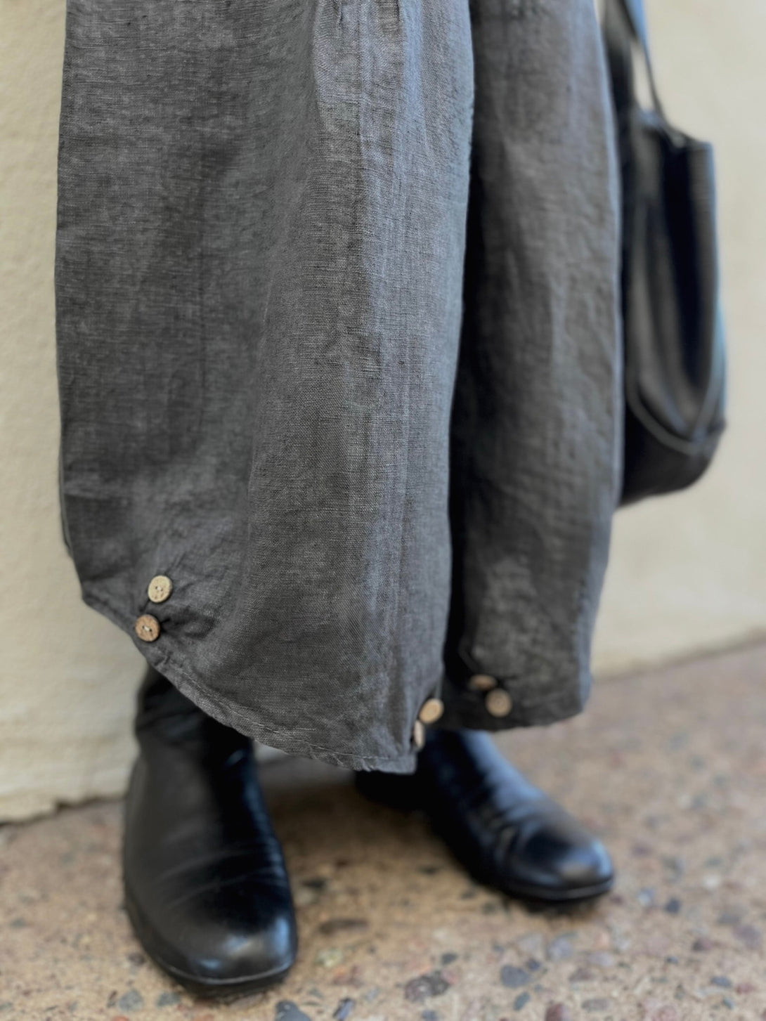 Conscious Coterie Yoli Pant in Charcoal close up view of buttons on the pants