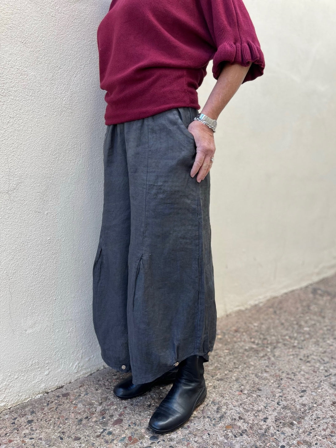 Conscious Coterie Yoli Pant in Charcoal side view of pants on woman with her hand in pocket