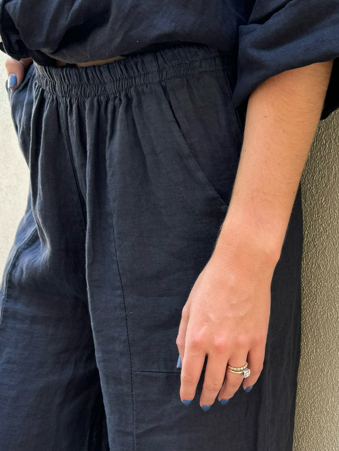 Conscious Coterie Yoli Pant in Navy on model detail waistband and pocket view