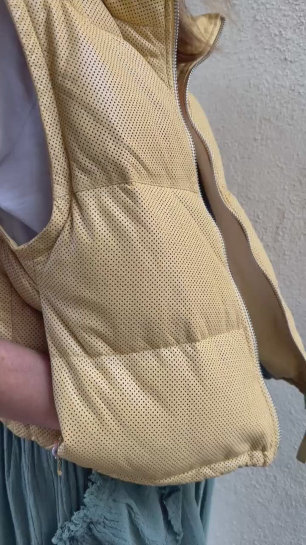 Conscious Coterie Ellice leather vest in light yellow video of woman wearing the vest