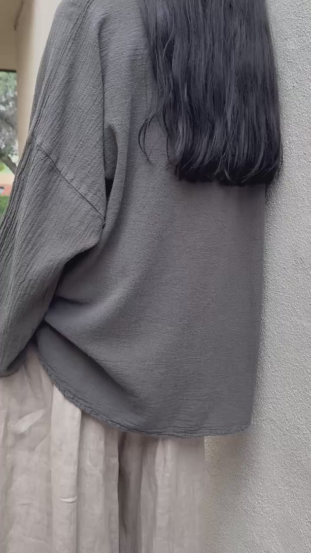 Conscious Coterie Alyssa top in Charcoal grey video of woman wearing long sleeve cotton shirt showing all angles