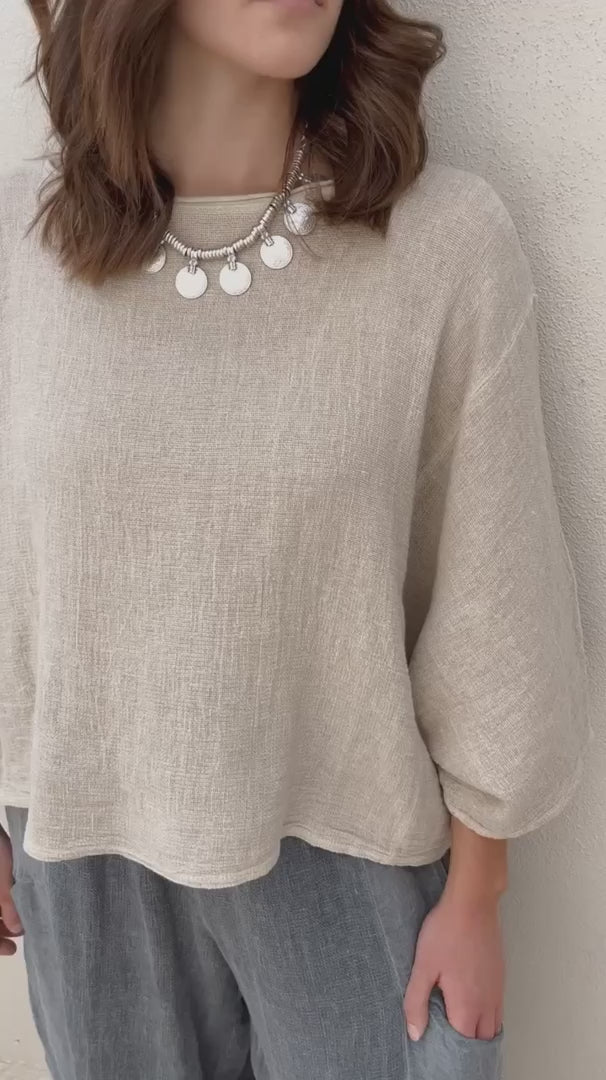 Conscious Coterie rhonda top in beige video of woman wearing shirt showing all angles