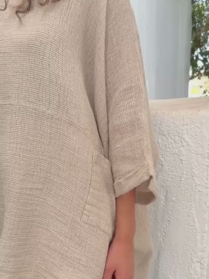 Conscious Coterie Lara top in beige video of woman wearing top showing fabric and front view