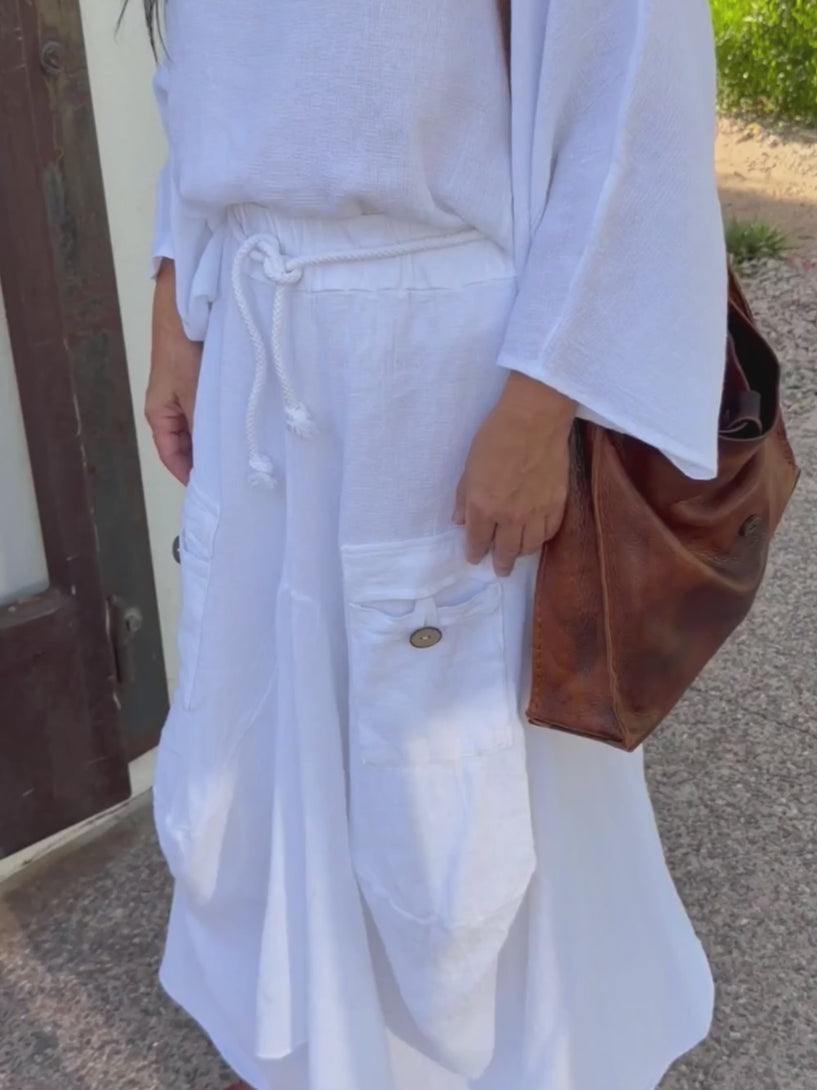 Conscious Coterie Quincy skirt in white video of woman wearing skirt showing all views of skirt